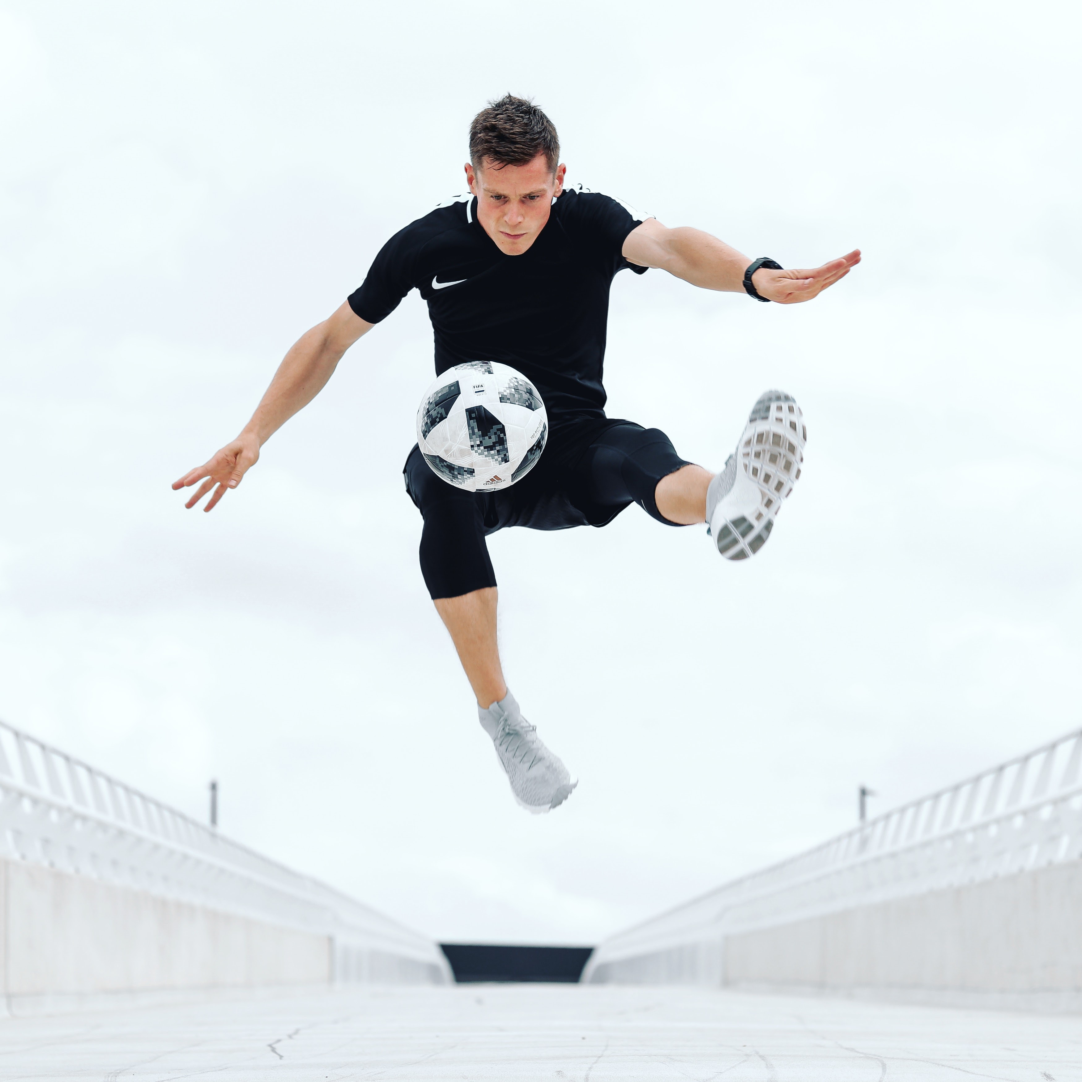 Man Kicking a Soccer Ball